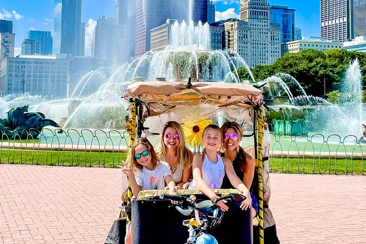 Explore Lincoln Park's scenic beauty from the comfort of a pedicab enjoying iconic landmarks fresh air and fun photo ops as you uncover the secrets of Chicago.
